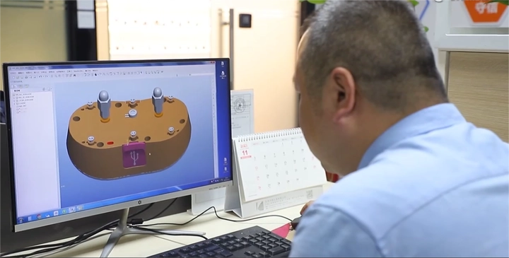 Pawty Global engineers working on smart pet feeder prototype with imaging schematics